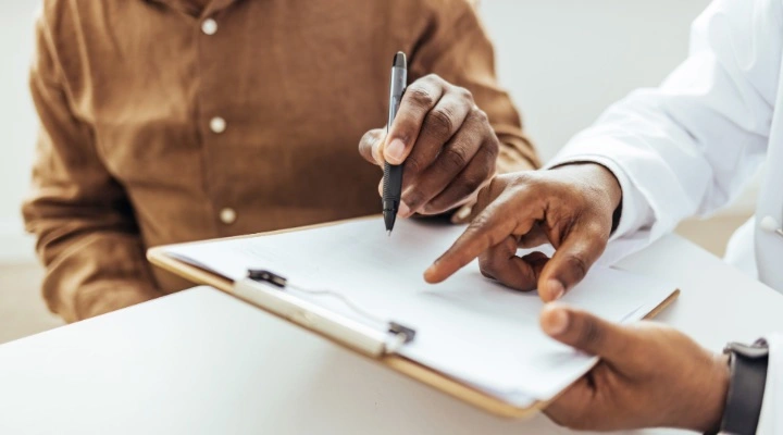 man filling out form